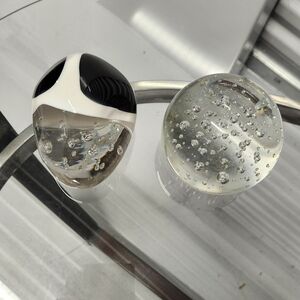 2 Paperweights Black and white, clear.